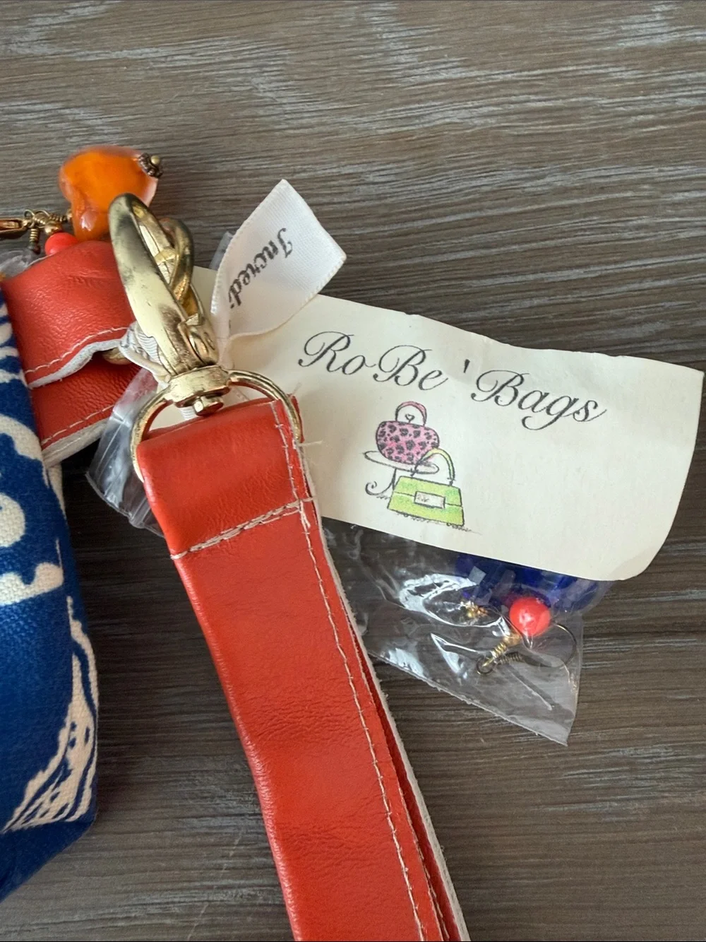Orange and Blue Paisley ID/Cosmetic Pouch with wristlet sleeve.